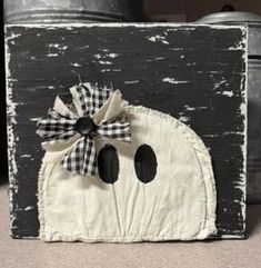 a black and white box with a bow on it