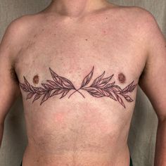 a man's chest with leaves on it