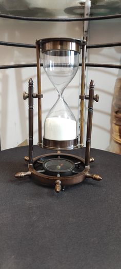 an hourglass sitting on top of a table