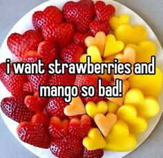 i want strawberries and mangos so bad on a white plate with hearts in the middle