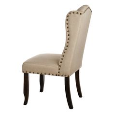 a beige upholstered chair with studding on the back