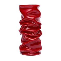 a tall red vase with wavy lines on it's sides and the top part of its body