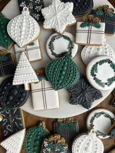 decorated christmas cookies on a white plate