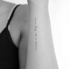 a woman's arm with writing on it