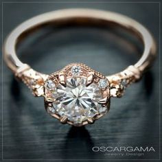 an engagement ring is shown on a black surface with the words oscarama written below it