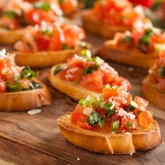 small breads with tomatoes and other toppings on them - stock photo - images