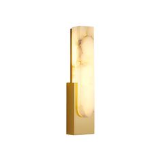 a light that is on the side of a white wall with a gold frame and marble design