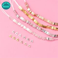 four pieces of gold and silver metal beads on a pink background with the words, no strings