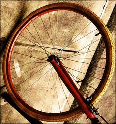 a close up of a bike tire on the ground with no wheels or spokes