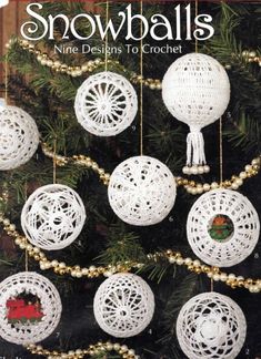 a crocheted christmas tree ornament with snowballs hanging from it's branches