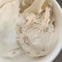 a bowl filled with ice cream sitting on top of a table