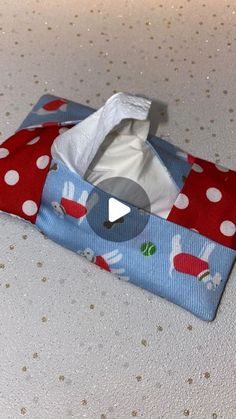 an image of a toilet paper roll in a bag on the table with polka dots