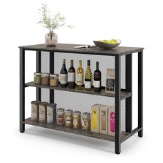 a shelf filled with bottles and glasses next to a bowl of lemons on top of a table