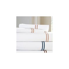 four white sheets with blue and brown striped trims are stacked on top of each other