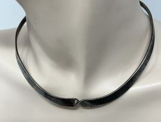 "BEAUTIFUL Vintage 925 Silver Twisted Cuff Collar Choker Necklace This has a twist design in the center Adjustable 3/8\" wide tappers down to 3/16\" Weighs 32g Stamped 925 And tested Sold as found with natural patina This will need a good polish Elevate your style with this vintage 925 silver twisted cuff collar choker necklace. The intricate design and timeless appeal make it an ideal addition to any jewelry collection. The collar style provides a unique twist on the traditional necklace, while the twisted design adds a touch of elegance. Crafted with 925 silver, this necklace boasts a high level of purity and quality. The vintage design is perfect for those who appreciate classic style and timeless beauty. Whether you're dressing up for a special occasion or adding a touch of sophisticat Traditional Necklace, Collar Choker, Choker Collar, Choker Necklaces, Intricate Design, High Level, Collar Style, Vintage Design, Timeless Beauty