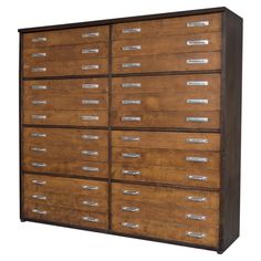 a large wooden cabinet with many drawers on it's sides and metal pulls in the middle