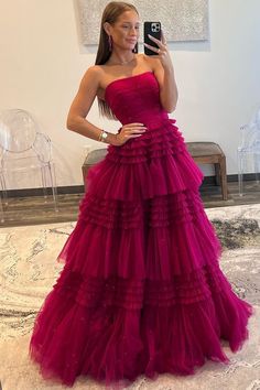 Rock this Peri-pleated, strapless tulle frock featuring tiers of ruffles, a built-in bra, and a zip-up back. Your full-length, dreamy-hued dress is perfect for a night of fun! Red Pink Prom Dress, Prom Dresses Fluffy, Layered Tulle Prom Dress, Fuchsia Prom Dress, Tiered Prom Dress, Tulle Long Prom Dress, Gown Prom Dresses, Prom Dress Inspo, Off Shoulder Evening Dress