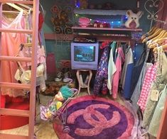 a room filled with lots of clothes and a tv