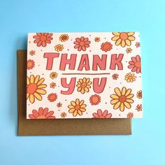 a thank you card with flowers and the words thank you written in large letters on it