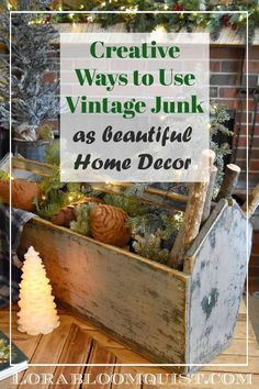 an old wooden box filled with christmas decorations and greenery on top of a table