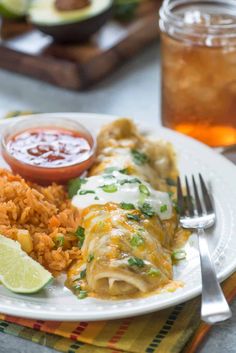 a white plate topped with mexican food and rice