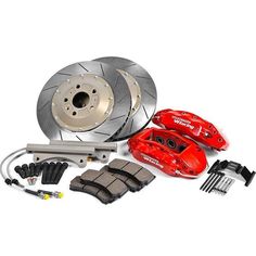 the front brake and rotors of a car with red brake pads, brake assembly kits and other accessories