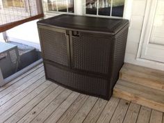 an outdoor storage box sitting on the porch