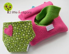 two little kolligans pink and green baby diapers with hearts on them