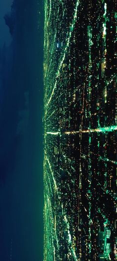 an aerial view of the city lights at night