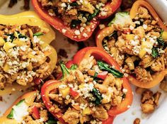 stuffed bell peppers in a white casserole dish