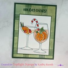 a handmade holiday card with two glasses of wine