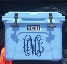 a blue cooler with the letter m on it