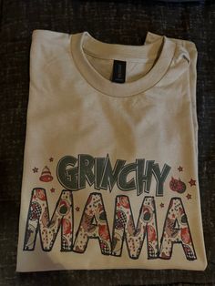 Grinchy Mama Tshirt just in time for the holidays 🎄 Mama Grinch Shirt, Grinch Nursing Shirts, Mama Tshirts, Just In Time, Festival Season, In Time, Printed Items, Beauty Book, Collectibles