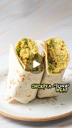 a burrito on a plate with the words chickpea - itana wrap