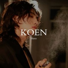 a woman holding a cell phone in her right hand with the words koen on it