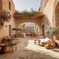 an outdoor patio with seating and potted plants