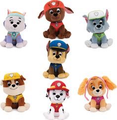 the stuffed animals are all different colors and sizes, but one is wearing a fireman's hat