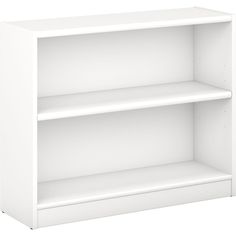 a white bookcase with two shelves on each side and one shelf above the other