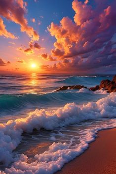 the sun is setting over the ocean with waves crashing in front of rocks and sand