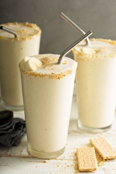 two glasses filled with ice cream and some crackers