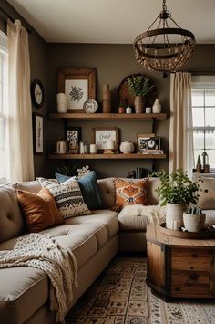 a living room filled with lots of furniture next to a window covered in pillows and blankets