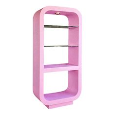 a pink shelf with two shelves on each side