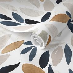 a white wallpaper with blue, brown and beige leaves on it's surface