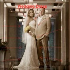 a man and woman standing next to each other in front of a building with the words wedding dress on it