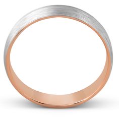 a wedding ring with two tone gold and silver in the middle, on a white background