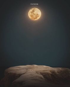 the full moon is shining brightly in the night sky