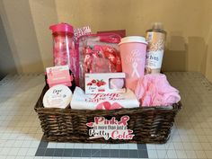 a basket filled with pink items on top of a tiled floor