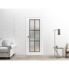 a living room with white brick walls and furniture