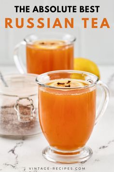 two mugs filled with russian tea on top of a table