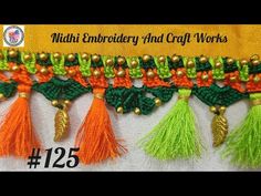 two rows of colorful tassels with gold beads on each side and an orange, green